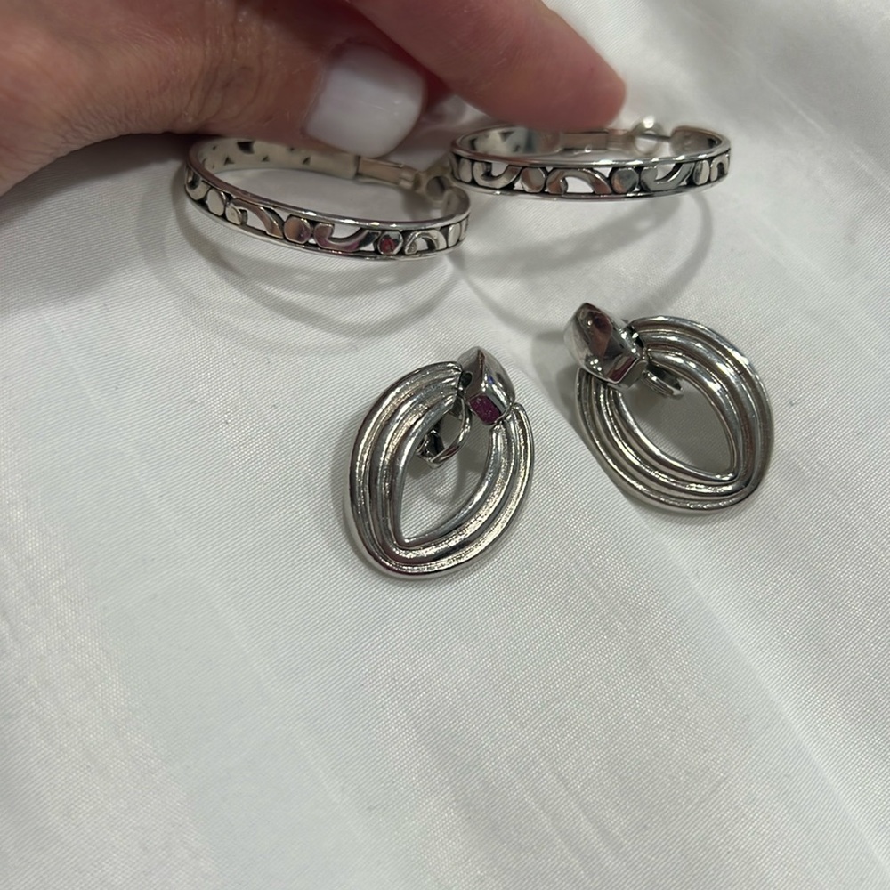 2 sets of what I believe are sterling silver earrings.